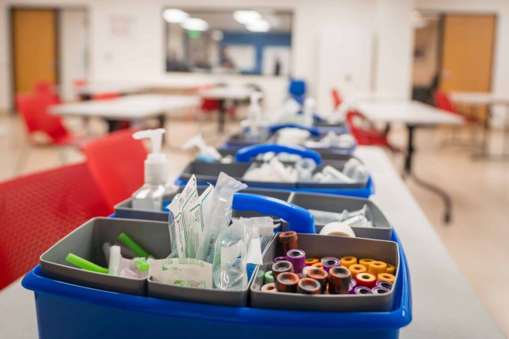 Multiple containers of training material for Phlebotomy students at Bama, a Phlebotomy school in California.