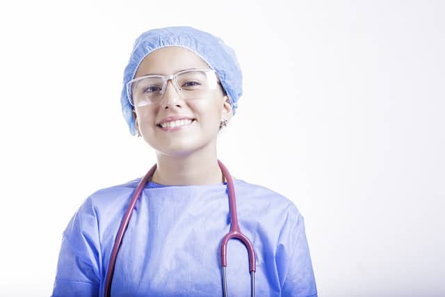 A  cheerful healthcare worker confident in her abilities and values -- those beliefs, standards, and principles that help shape them as people.