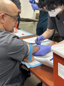 Students training to become a phlebotomist