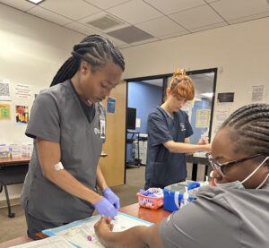 phlebotomy students training for a healthcare career